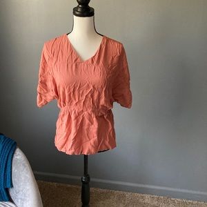 Coral colored blouse
